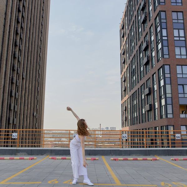 Person feeling energetic and balanced in a bright, open space.